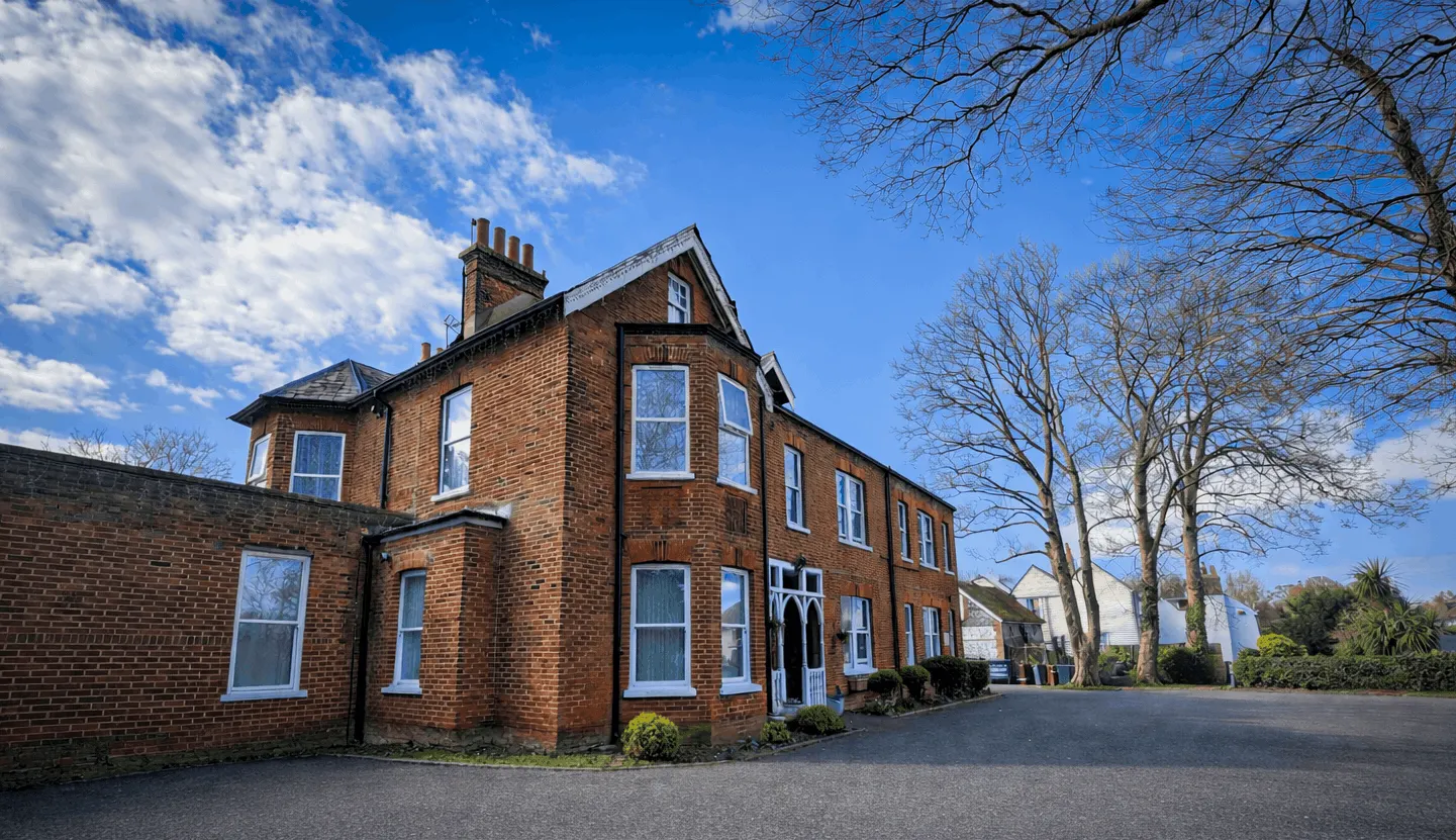 The grand Tudor-style exterior of Parkside Nursing Home in Banstead, Surrey